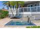Close-up of the backyard water feature highlighting its intricate tile work and serene ambiance near waterfront at 17382 Kennedy Dr, North Redington Beach, FL 33708
