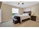 Bedroom with a bed, a ceiling fan, neutral tones, and carpet flooring at 1751 Split Fork Dr, Oldsmar, FL 34677