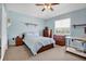 A lovely bedroom with wooden furniture, carpet flooring, and shelves for storage at 1751 Split Fork Dr, Oldsmar, FL 34677