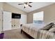 Bedroom featuring a neutral-toned walls, carpet flooring, and double door closet at 1751 Split Fork Dr, Oldsmar, FL 34677