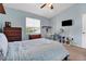 Comfortable bedroom with light blue walls, carpet, window, and desk at 1751 Split Fork Dr, Oldsmar, FL 34677
