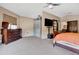 Bedroom showcasing neutral walls, carpet flooring, a ceiling fan, and a walk-in closet at 1751 Split Fork Dr, Oldsmar, FL 34677