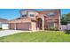 Charming two-story home with landscaped yard, a three-car garage, and a well-maintained lawn at 1751 Split Fork Dr, Oldsmar, FL 34677