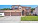 Beautiful two-story home with well-manicured front yard and 3 car garage at 1751 Split Fork Dr, Oldsmar, FL 34677
