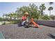 An outdoor playground with slides, climbing structures, and a soft rubber surface, perfect for Gathering fun at 1751 Split Fork Dr, Oldsmar, FL 34677