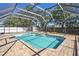 Fenced backyard with screened pool, brick pavers, and storage shed at 1751 Split Fork Dr, Oldsmar, FL 34677