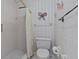 Full bathroom features a stand-up shower, ceramic tiling, and neutral wall decor at 1800 Mariner Dr # 2, Tarpon Springs, FL 34689