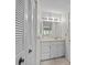 En suite bathroom features a single sink vanity and additional closet space at 1800 Mariner Dr # 2, Tarpon Springs, FL 34689