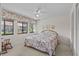 Bright bedroom features large windows, neutral walls, ceiling fan, and comfortable, relaxing atmosphere at 1800 Mariner Dr # 2, Tarpon Springs, FL 34689