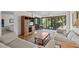 Inviting living room, adjacent sunroom, and serene views create the perfect retreat at 1800 Mariner Dr # 2, Tarpon Springs, FL 34689