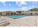 Community pool with lounge chairs and ample sunshine for residents at 1800 Mariner Dr # 2, Tarpon Springs, FL 34689