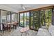 An airy sun room with a peaceful lake view, and sliding glass doors to the outdoors at 1800 Mariner Dr # 2, Tarpon Springs, FL 34689