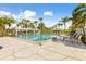 Stunning swimming pool area with ample lounge seating and beautifully designed landscaping, perfect for relaxation at 1800 Mariner Dr # 2, Tarpon Springs, FL 34689