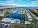 Panoramic aerial view features a waterfront community with canal access and a central pool area at 18675 Us Highway 19 N # 140, Clearwater, FL 33764