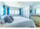 This bedroom features a comfortable bed with a white comforter, a dresser with a mirror, and lots of storage space at 18675 Us Highway 19 N # 140, Clearwater, FL 33764