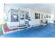 Charming exterior with a sunroom, carport, and inviting details creating a welcoming home environment at 18675 Us Highway 19 N # 140, Clearwater, FL 33764