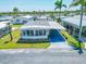 Well-kept single-story home with a carport and lush landscaping in a vibrant neighborhood at 18675 Us Highway 19 N # 140, Clearwater, FL 33764