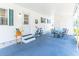 Beautiful exterior featuring a large covered carport, patio seating, beach basket and well maintained yard at 18675 Us Highway 19 N # 140, Clearwater, FL 33764