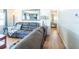 Bright living room with comfortable sofas, wood floors, and access to the bedroom at 18675 Us Highway 19 N # 140, Clearwater, FL 33764