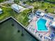 Beautiful community pool and spa with plenty of lounge chairs, overlooking a body of water at 18675 Us Highway 19 N # 140, Clearwater, FL 33764
