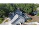 Aerial view of a lovely home showing backyard pool and lush landscaping and backyard at 1916 River Crossing Dr, Valrico, FL 33596