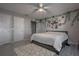 Bedroom featuring a bed, ceiling fan, and decorations on the wall at 1916 River Crossing Dr, Valrico, FL 33596