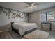 Bedroom features a bed, ceiling fan, and a bright window at 1916 River Crossing Dr, Valrico, FL 33596