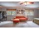 Relaxing bedroom with a comfortable seating area and a ceiling fan for added comfort at 1916 River Crossing Dr, Valrico, FL 33596