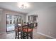 Dining area adjacent to the kitchen features a view and access to the screened in pool at 1916 River Crossing Dr, Valrico, FL 33596