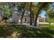 Charming home with mature trees, landscaped front yard, and a cozy curb appeal at 1916 River Crossing Dr, Valrico, FL 33596