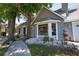 Well-maintained home featuring a lovely bay window, attractive landscaping, and mature trees at 1916 River Crossing Dr, Valrico, FL 33596