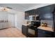 Efficient kitchen space featuring a modern oven and microwave, complemented by ample cabinet storage at 1916 River Crossing Dr, Valrico, FL 33596