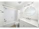 Bathroom features a shower-tub combination, white vanity with a bright and clean design at 2070 Sunset Point Rd # 111, Clearwater, FL 33765