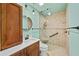 Bathroom featuring a glass-enclosed shower, a modern vanity, and stylish fixtures for a fresh and clean design at 2070 Sunset Point Rd # 111, Clearwater, FL 33765