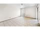 Spacious bedroom with tile floors and ample natural light, ready for personalization and comfort at 2070 Sunset Point Rd # 111, Clearwater, FL 33765