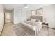 Comfortable bedroom featuring neutral tones, closet, and decorative art creating a relaxing retreat at 2070 Sunset Point Rd # 111, Clearwater, FL 33765
