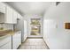 Efficient kitchen with a view, offering streamlined appliances and tile flooring for a functional and inviting space at 2070 Sunset Point Rd # 111, Clearwater, FL 33765