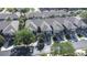 Overhead view showcasing the townhome-style homes with garages and mature landscaping at 2150 River Turia Cir, Riverview, FL 33578