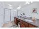 Bathroom with double vanity, large mirror and a glass-enclosed shower at 2150 River Turia Cir, Riverview, FL 33578