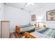 Guest bedroom offering two twin beds, featuring wood-look floors at 2150 River Turia Cir, Riverview, FL 33578