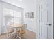 Bright breakfast nook with tile floors, natural light and a door leading to the lanai at 2150 River Turia Cir, Riverview, FL 33578