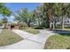 Well maintained community park with winding sidewalks, mature trees, and landscaping at 2150 River Turia Cir, Riverview, FL 33578