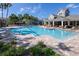Resort-style pool with a sundeck, lounge chairs, and nearby clubhouse at 2150 River Turia Cir, Riverview, FL 33578