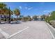 Gated community entrance with brick pillars, mature landscaping, and secured access for resident privacy at 2150 River Turia Cir, Riverview, FL 33578