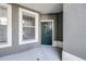 Covered front door and window with natural light at 2150 River Turia Cir, Riverview, FL 33578