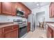 Updated kitchen with stainless steel appliances and ample cabinet space is ready for your culinary creations at 2150 River Turia Cir, Riverview, FL 33578
