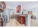 Updated kitchen with stainless-steel appliances is open to the living room and eat-in dining area at 2150 River Turia Cir, Riverview, FL 33578
