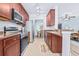Updated kitchen with stainless steel appliances and ample cabinets for storage at 2150 River Turia Cir, Riverview, FL 33578