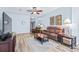 Relaxing living room features a ceiling fan, recessed lights, and neutral tones, and updated floors at 2150 River Turia Cir, Riverview, FL 33578