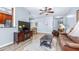 Open living area features wood-look floors and access to dining area and kitchen at 2150 River Turia Cir, Riverview, FL 33578